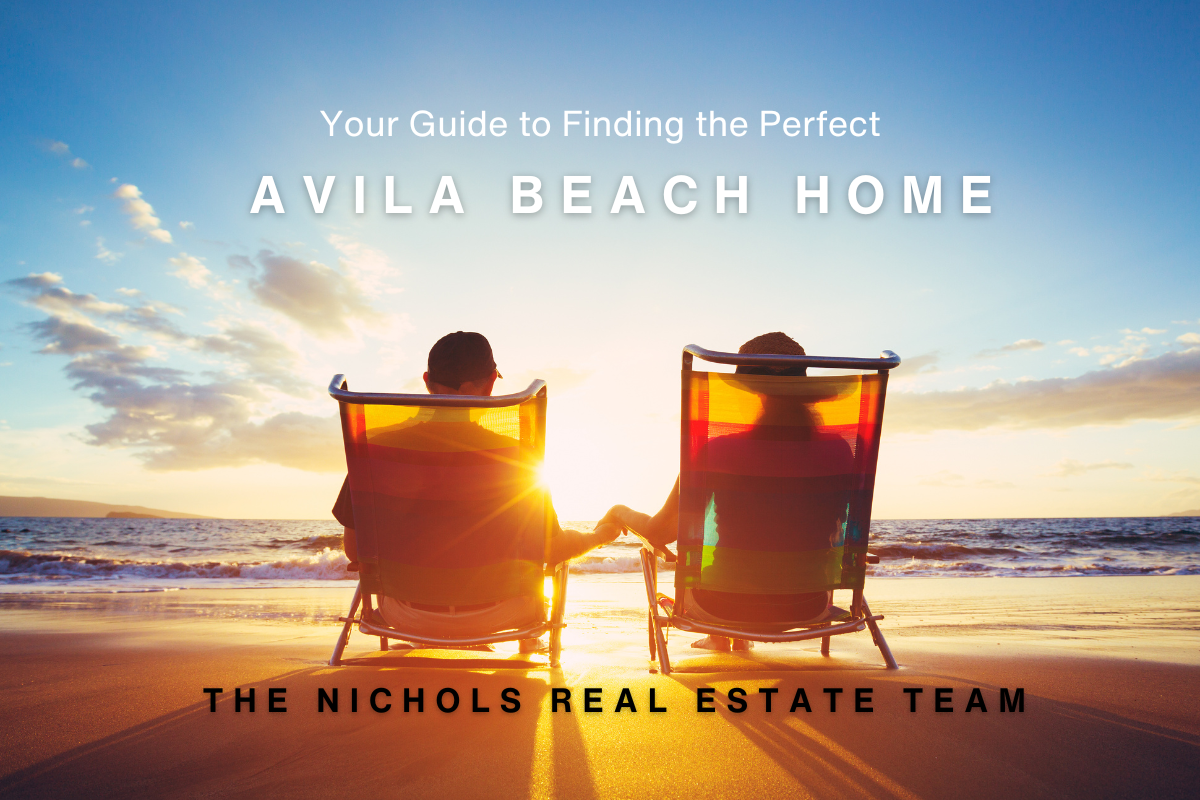 Couple watching a beach sunset while relaxing in chairs, promoting the search for the perfect Avila Beach vacation home with The Nichols Real Estate Team.